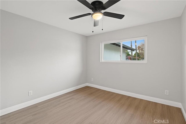 empty room with ceiling fan and light wood-type flooring