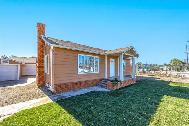 view of front facade with a garage and a front lawn