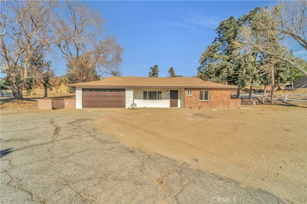 ranch-style home with a garage