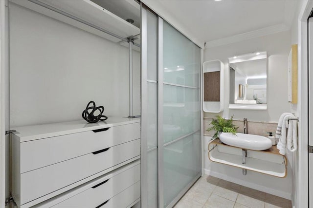 interior space featuring sink and light tile patterned floors