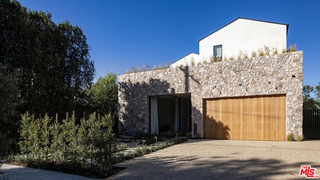 view of front of property with a garage