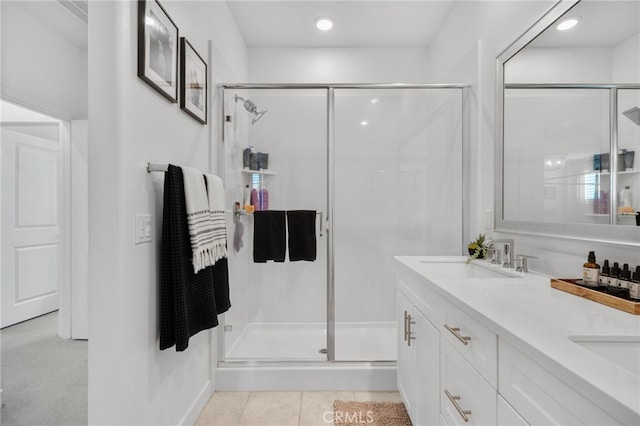 bathroom featuring vanity, walk in shower, and tile patterned floors