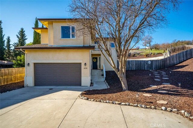 view of front of property with a garage