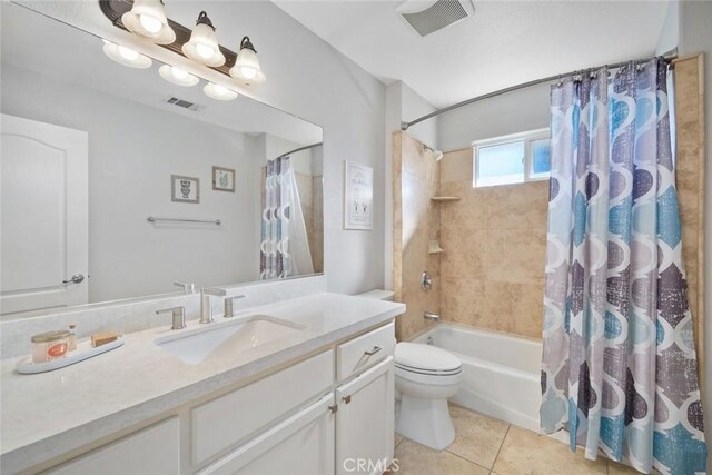 full bathroom featuring vanity, toilet, tile patterned floors, and shower / bath combo