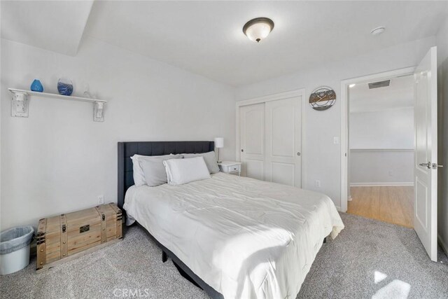 bedroom featuring a closet and carpet flooring