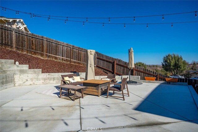 view of patio with an outdoor fire pit