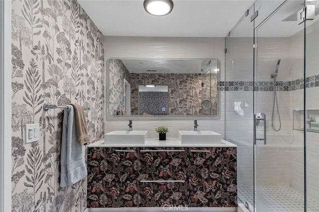 bathroom with an enclosed shower and vanity