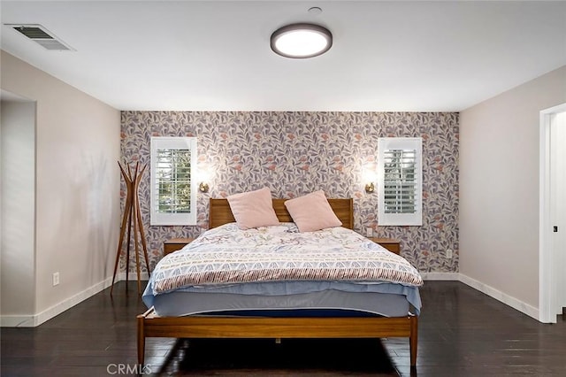 bedroom featuring dark hardwood / wood-style floors