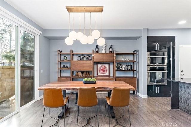 dining area featuring hardwood / wood-style flooring