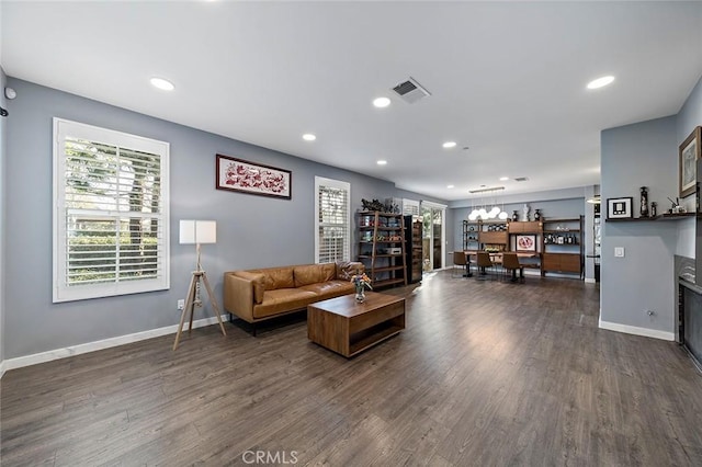 living room with dark hardwood / wood-style flooring