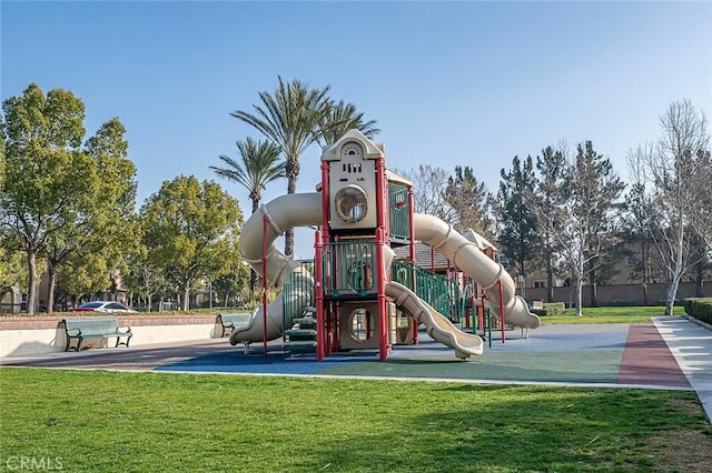 view of jungle gym featuring a lawn