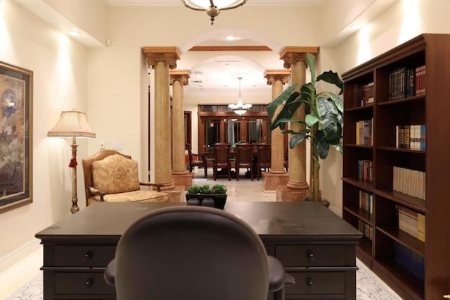 office area with an inviting chandelier and ornate columns