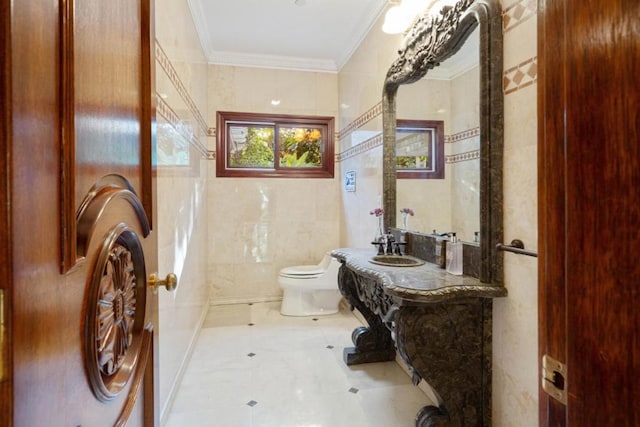 bathroom with ornamental molding, tile walls, vanity, and toilet