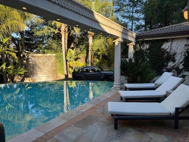 view of swimming pool featuring a patio