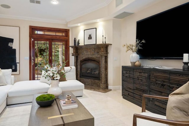 living room with a fireplace and ornamental molding