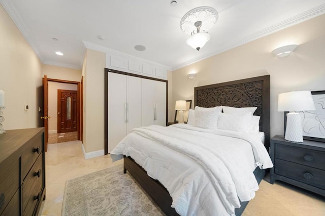 bedroom featuring crown molding and a closet