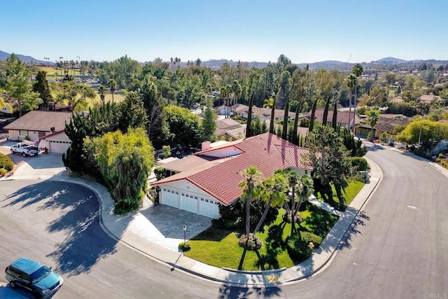 birds eye view of property featuring a mountain view