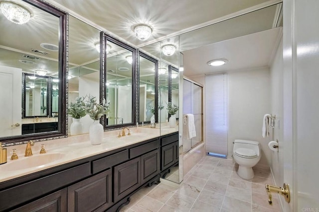 full bathroom featuring enclosed tub / shower combo, vanity, and toilet