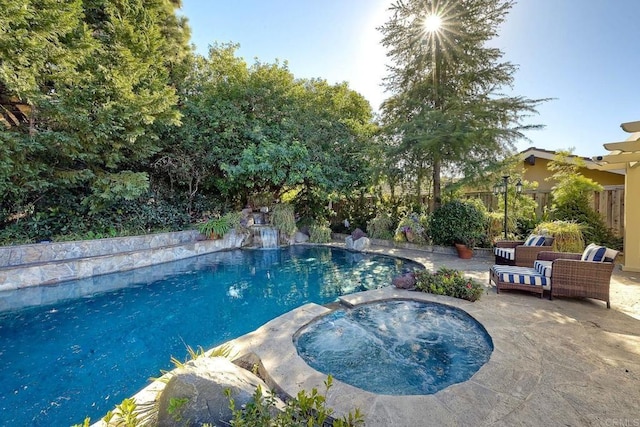 view of pool with an in ground hot tub and a patio