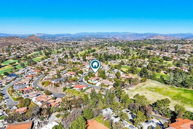 birds eye view of property with a mountain view