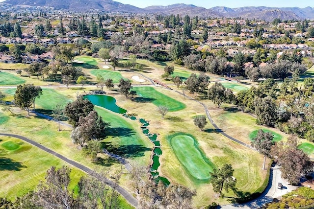 drone / aerial view with a water and mountain view