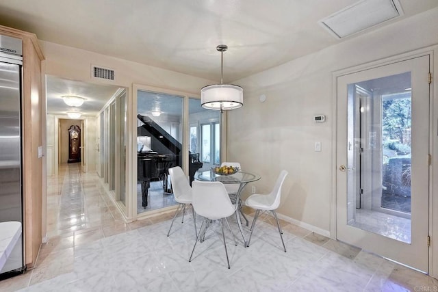 dining area with plenty of natural light