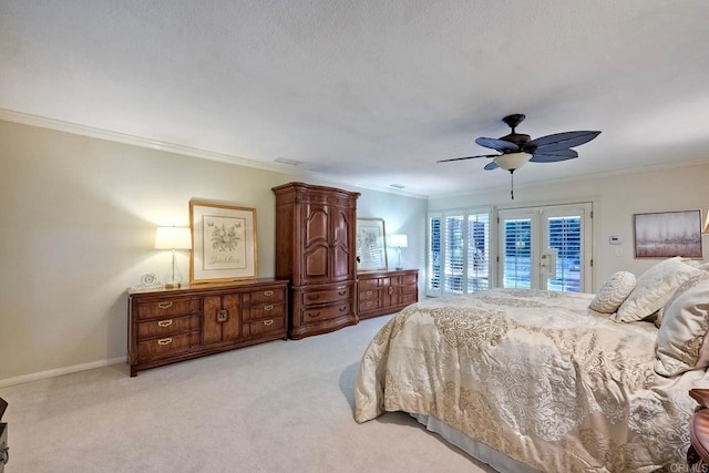 bedroom featuring crown molding, ceiling fan, access to exterior, light colored carpet, and french doors