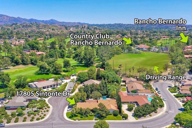 birds eye view of property featuring a mountain view