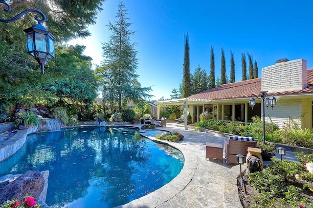 view of pool featuring a patio