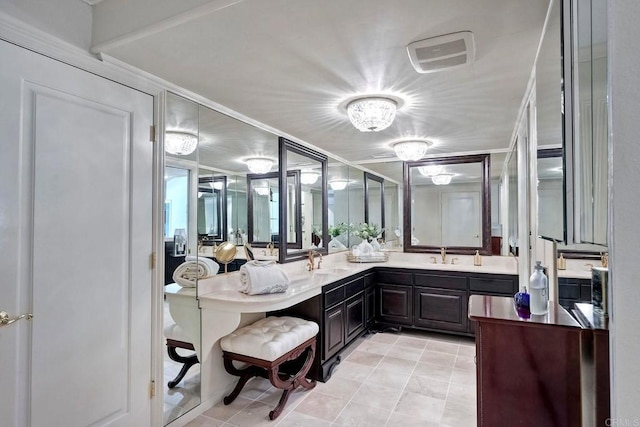 bathroom with tile patterned floors and vanity