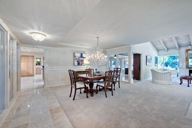 carpeted dining space featuring a notable chandelier