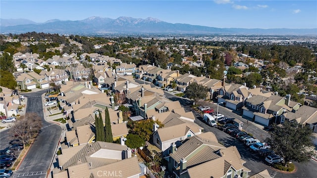 birds eye view of property featuring a mountain view