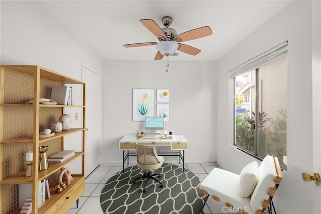 office with ceiling fan and light tile patterned floors