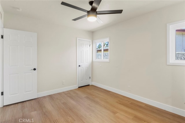 unfurnished bedroom featuring ceiling fan and light wood-type flooring