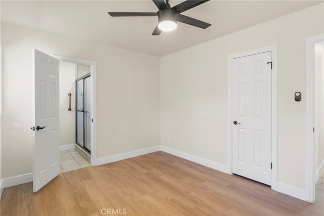 unfurnished room with light hardwood / wood-style flooring and ceiling fan