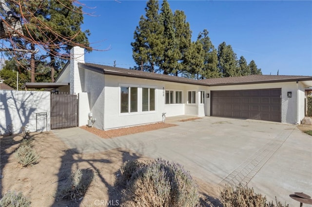 ranch-style home featuring a garage