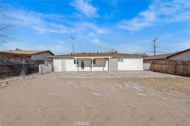 rear view of house featuring a patio area