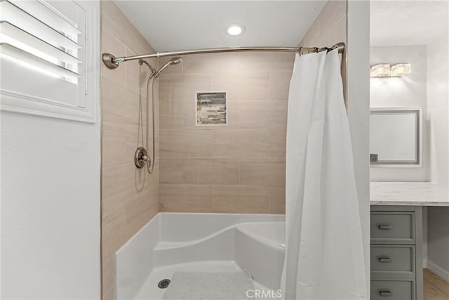 bathroom with curtained shower and vanity