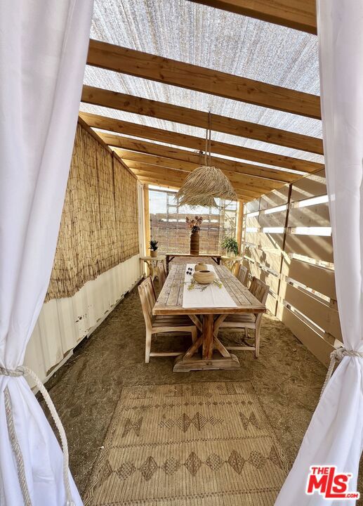 dining area featuring vaulted ceiling