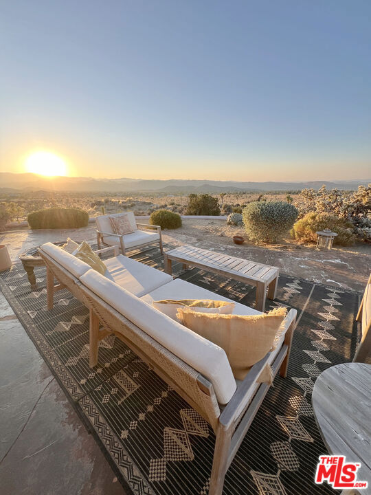 view of patio terrace at dusk