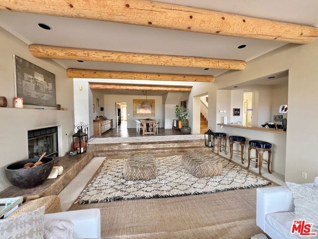 living room with beam ceiling