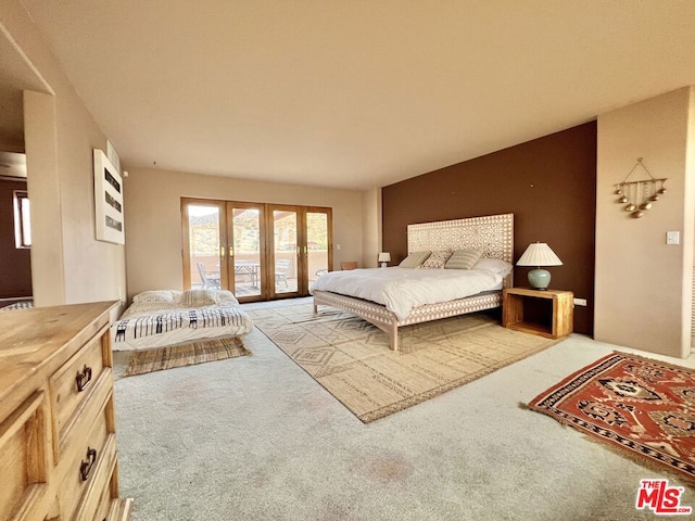 bedroom featuring light colored carpet