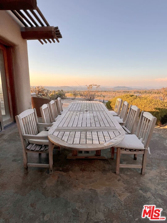 view of patio terrace at dusk