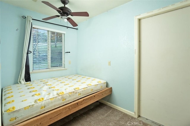 bedroom with ceiling fan and carpet