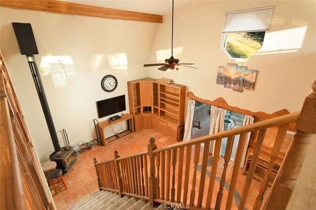 stairs featuring tile patterned floors and vaulted ceiling with beams