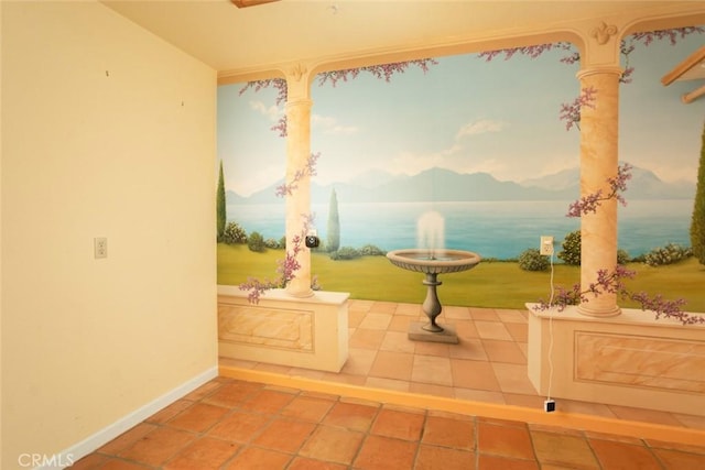 bathroom with a water view and tile patterned flooring