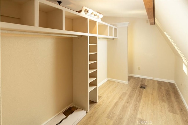 walk in closet featuring hardwood / wood-style flooring