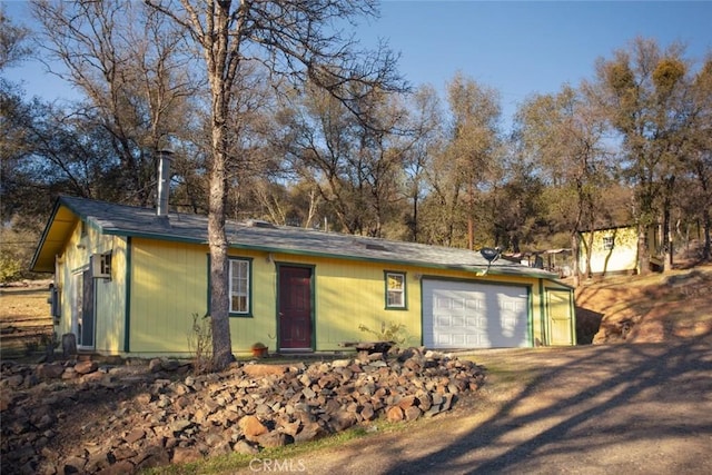 ranch-style house featuring a garage