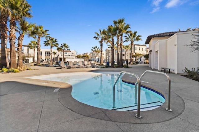 view of swimming pool featuring a patio area