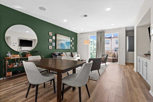 dining area with light hardwood / wood-style flooring